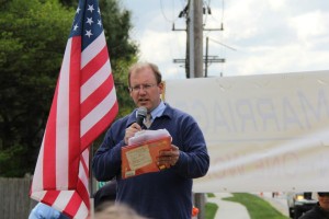 AFTAH's Peter LaBarbera speaking at IFI rally against homosexuality-based "marriage." He is holding a "children's" book, "King & King," that promotes same-sex "marriage" to innocent children. The book is about a prince who "marries" another prince, rather than a princess. A man disrupted the speech, yelling out to LaBarbera and asking if he wanted to "round up" homosexuals and put them in camps.