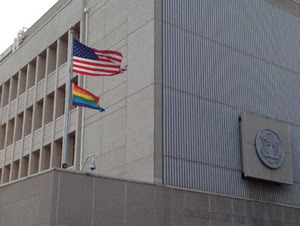 Homosexual activist "rainbow flag" flies beneath Old Glory at the U.S. Embassy in Tel Aviv, Israel.