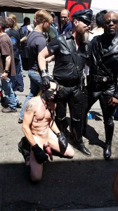 A younger male "slave" poses with his "master" at the "Up Your Alley" BDSM-celebrating street fair in San Francisco last Sunday. 