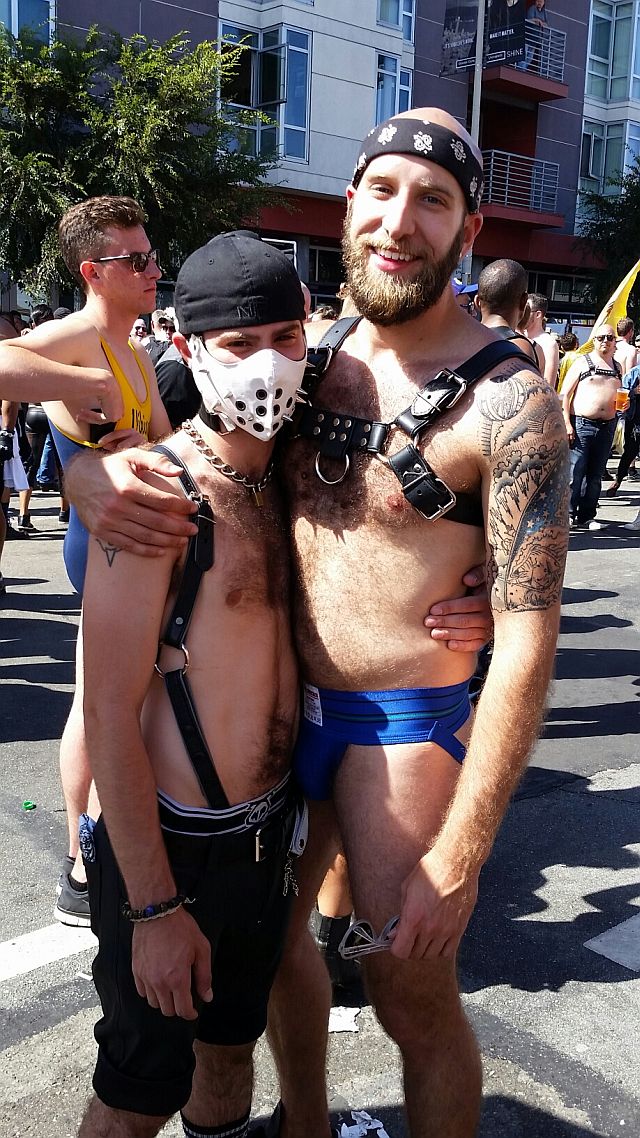 THIS BOY IS NOT PLAYING HOCKEY PLAYER: Grown man poses with boy "slave" at Up Your Alley Fair in San Francisco. I saw more than a few "Master/Slave"  "couples" in which the master was much older than the boy.